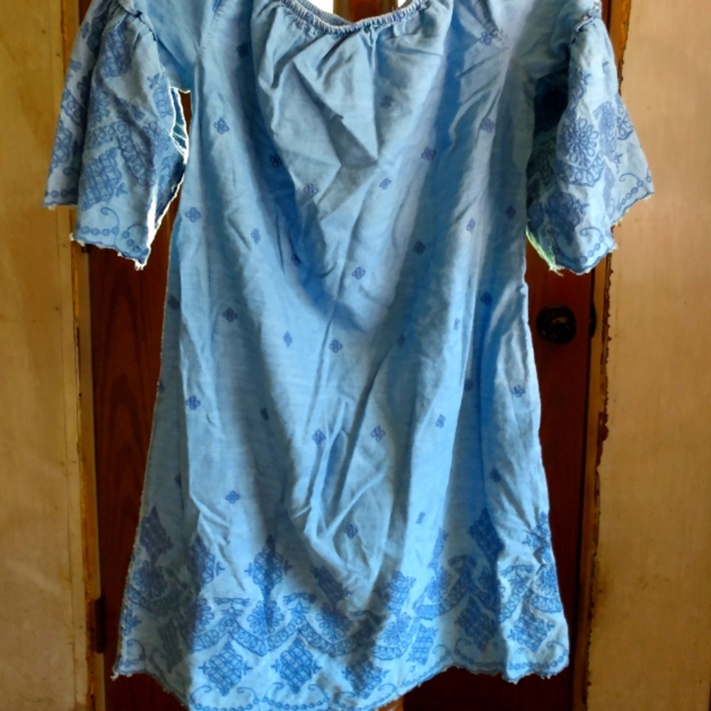 Baby doll dress ,with embroidered design threw it